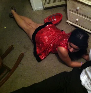 Girl in a Red Dress Lying on the Floor Home Creepshot