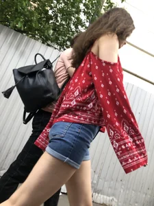 Very hot candid girl in denim shorts walking down the train platform