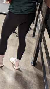 Tight legs and ass in black legging. Bend over