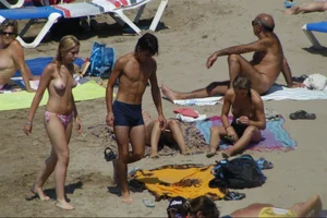 Girls on a nude beach in Sitges, Spain
