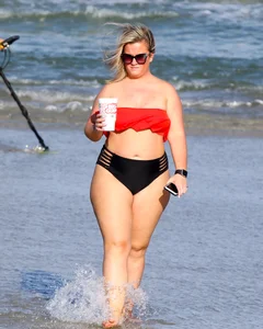 Thick BBW blonde lady in a bikini at the beach