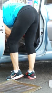 Girl in tight see through leggings with nice ass cleaning her car