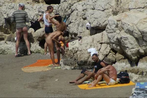 Girls on a nude beach in Sitges, Spain
