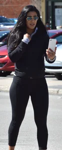 Thick brunette with a big booty in tight black leggings