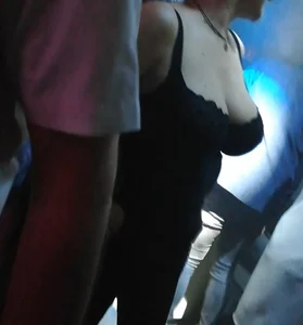 Busty milf in the disco. Big tits, big nipples