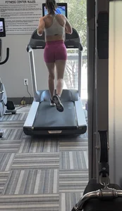 Fit brunette on treadmill