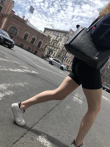 Great legs and booty in spandex shorts of a street candid girl crossing the street