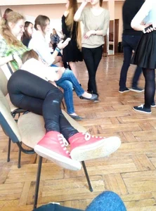 Candid Photo of Skinny Teen JB Lying on Chairs in Leggings