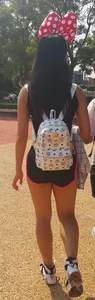 Hot skinny girl in shorts with a backpack