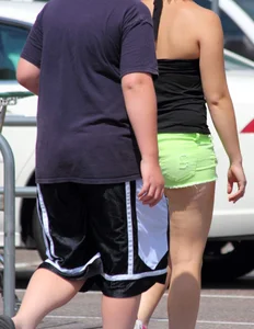 Blonde girl in glasses with a thick booty in green shorts