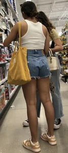 Latina in jean shorts and a crop top