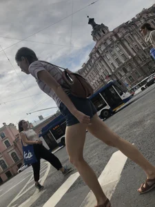 Young Girl in Shorts And Sandals Crossing the Street Gallery