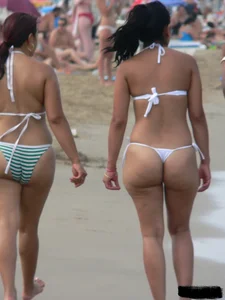 Bunch of sexy babes at the beach in thong bikinis