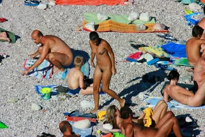 FKK Nudists playing in the water with floater
