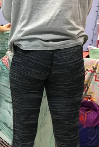 Ass standing around in tight grey patterned leggings