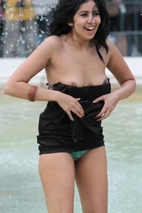 Fountain girl in a skirt accidentally shows her tits and panties