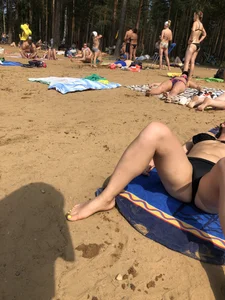 Candid Girls Lying on a Beach With Spread Legs Photos