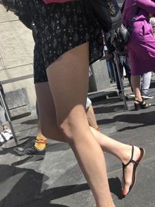 Long Skinny Legs in a Skirt and Feet in Sandals Closeup Creepshots on the Street