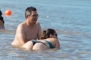 Candid beach girls in thongs