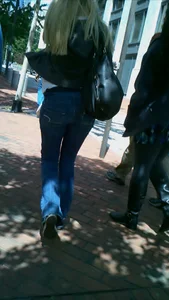 Blonde in tight jeans with her red thong sticking out
