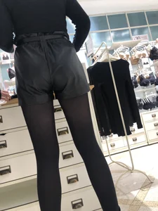 Shop Assistant's Flat Booty in Leather Shorts And Legs in Black Pantyhose Store Creepshots Gallery