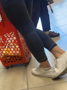 Sexy butt in tight grey jeans with a phone in her back pocket grocery store creepshot