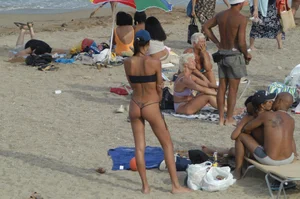 Topless girls on a beach in Barcelona