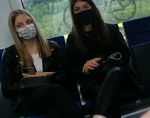 A couple of hot chicks in masks and tight pants sitting in a public bus creepshots