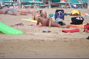 Girls on a nude beach in Bibione, Italy