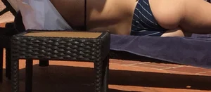 Blonde laying out in a blue bikini with a sexy body