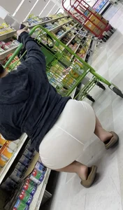 Visible Thong White Shorts in the supermarket
