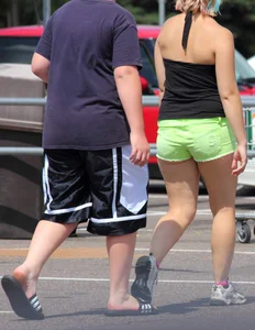 Blonde girl in glasses with a thick booty in green shorts