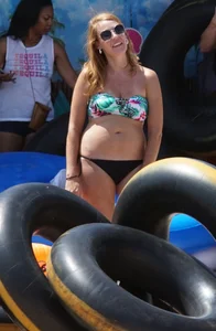 Girls in bikinis getting ready for tubing