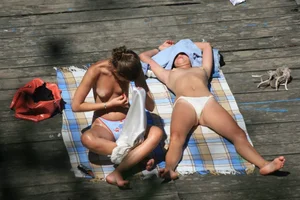 Two teens stripping and going topless to tan
