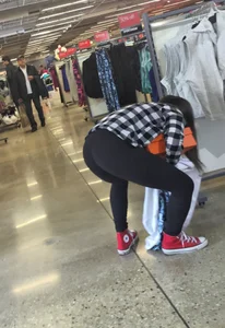Cute Girl in Yoga Pants Bending Over at the Store