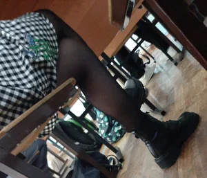 Legs of candid college teens wearing pantyhose in class