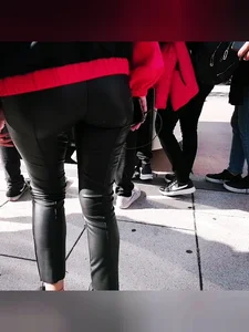 Ass in leather pants closeups on the street
