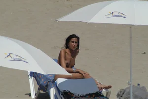 Girls on a nude beach in Sitges, Spain