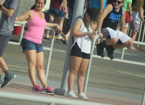 Couple of babes standing around in shorts