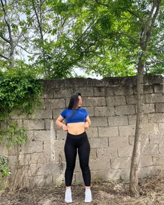 Nice non-candid girl in a top and leggings showing off her tummy