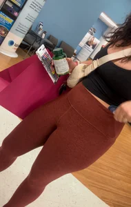 Cute girl in maroon leggings w cleavage