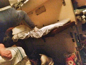 Teen in Track Pants in a Sleeping Train Car Candid
