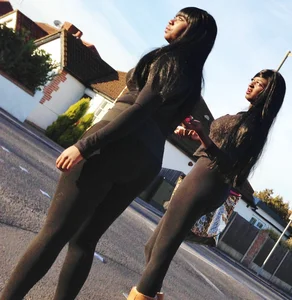 2 sexy black girls in leggings with nice asses