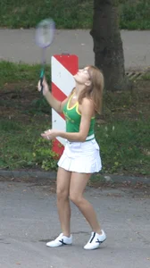 Pretty girl playing tennis in a skirt and walking in jeans