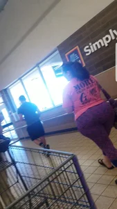Fat booty milf in purple leggings at the grocery store