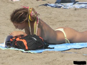Sexy girls going topless at the beach showing off their sexy bodies