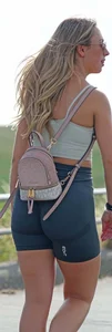 Blonde woman in lycra shorts - good front view, back view ruined by a bag