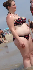 Fat chick with big boobs at the beach in a bikini