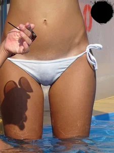 Sexy bikini babe in a white bikini at the pool with camel toe