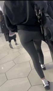 Tight curvy latina at airport pulls up pants